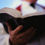 Pastor Holding Bible ca. 2000